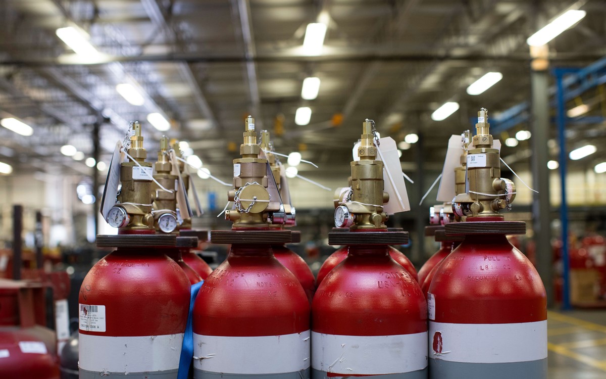 Fire extinguishers in a line next to each other