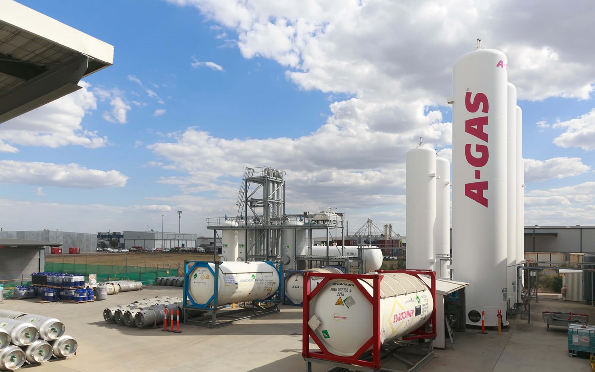 The A-Gas Australia site from a wide angle above shot, there are A-Gas branded industrial cylinders in the foreground of the image