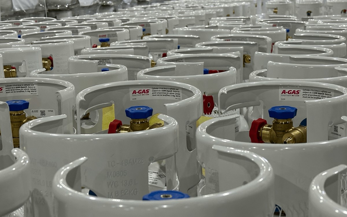 Rows of grey cylinders in a warehouse 