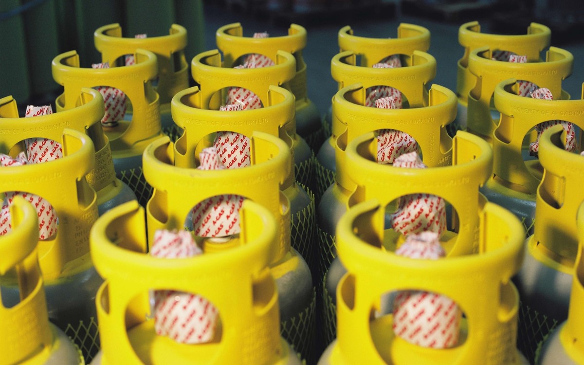 Rows of Recovery cylinders lined up, they have yellow cylinder tops