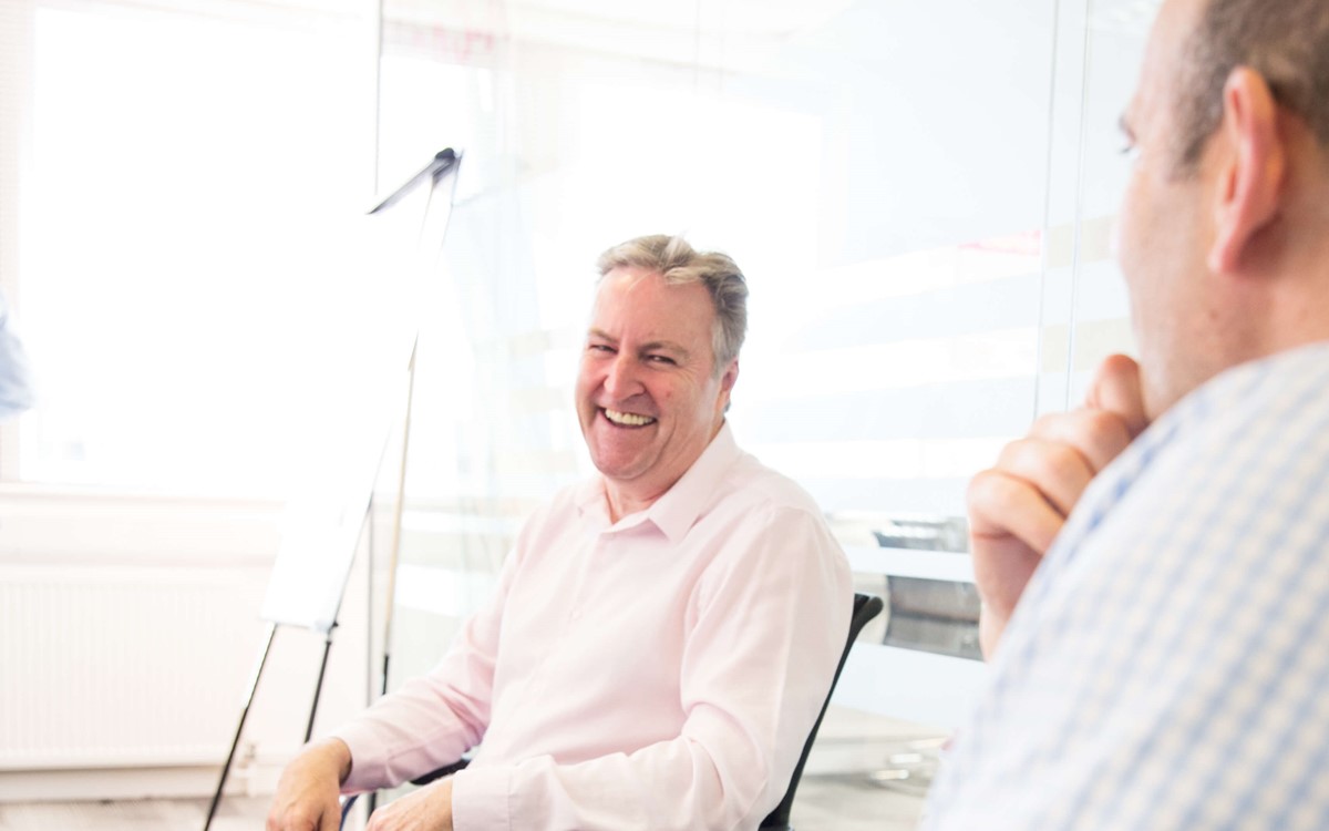 laughing in a meeting