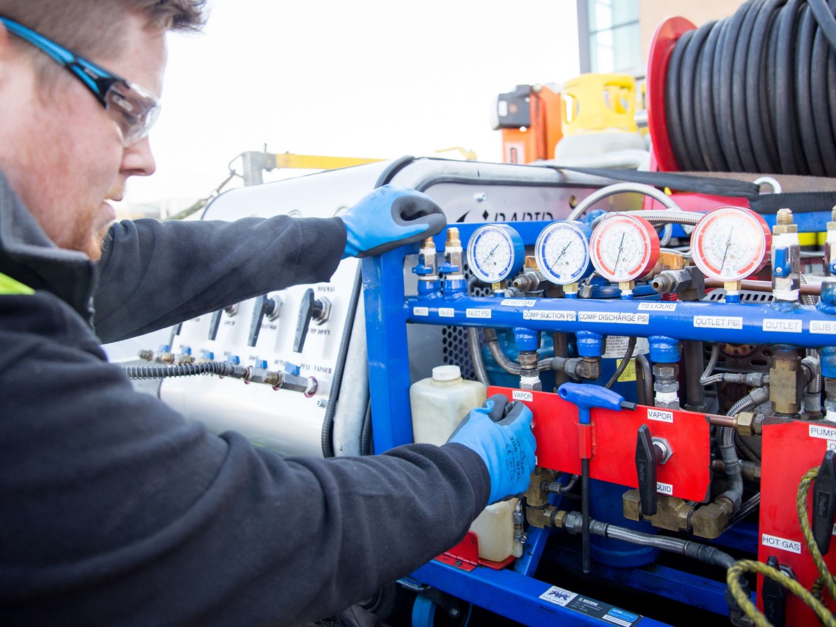 service engineer operating recovery equipment