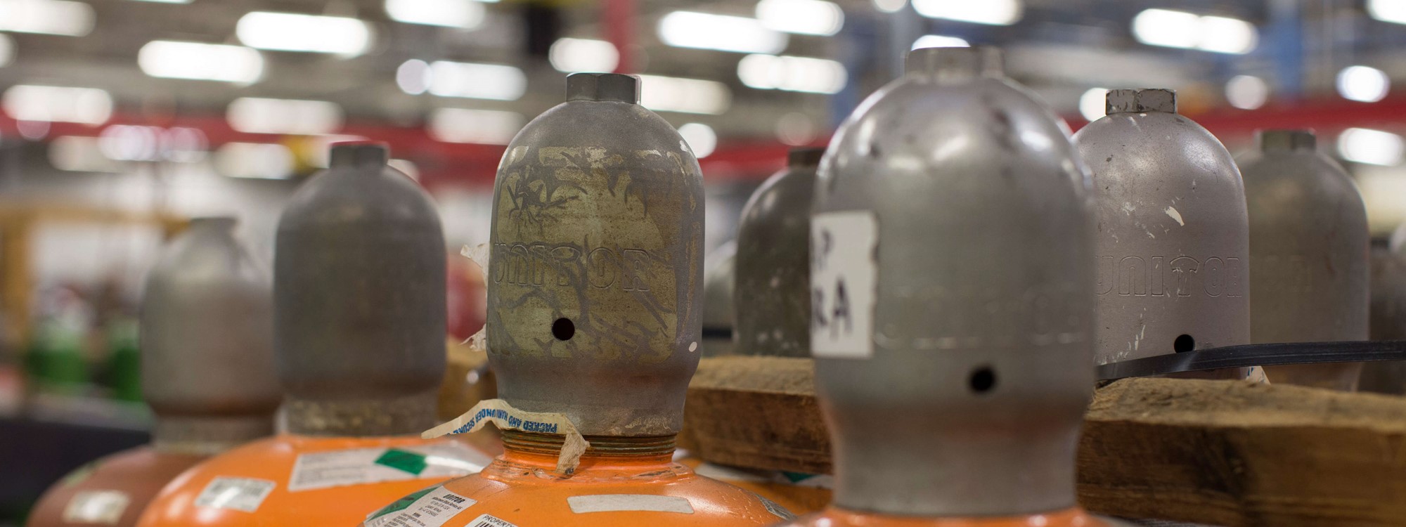 A close up of red cylinder heads in a row
