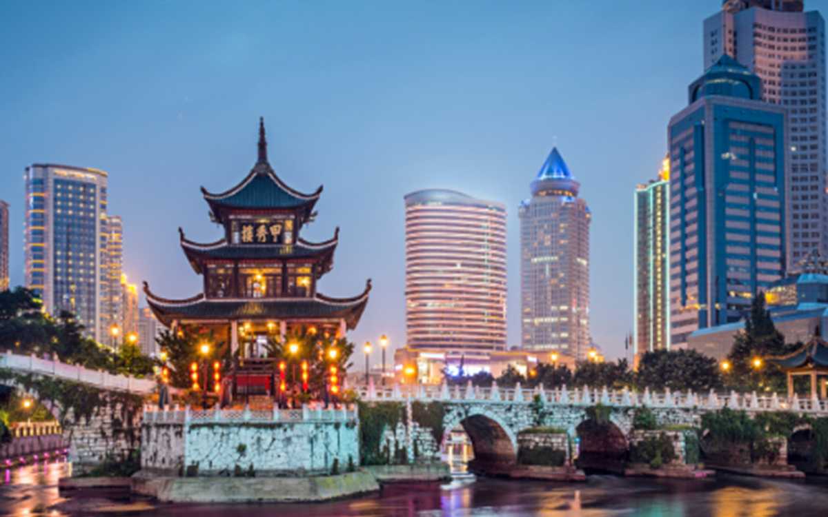 An image of China with traditional buildings on the water