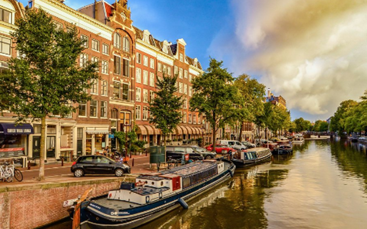 An image of canal boats in the Amsterdam canal